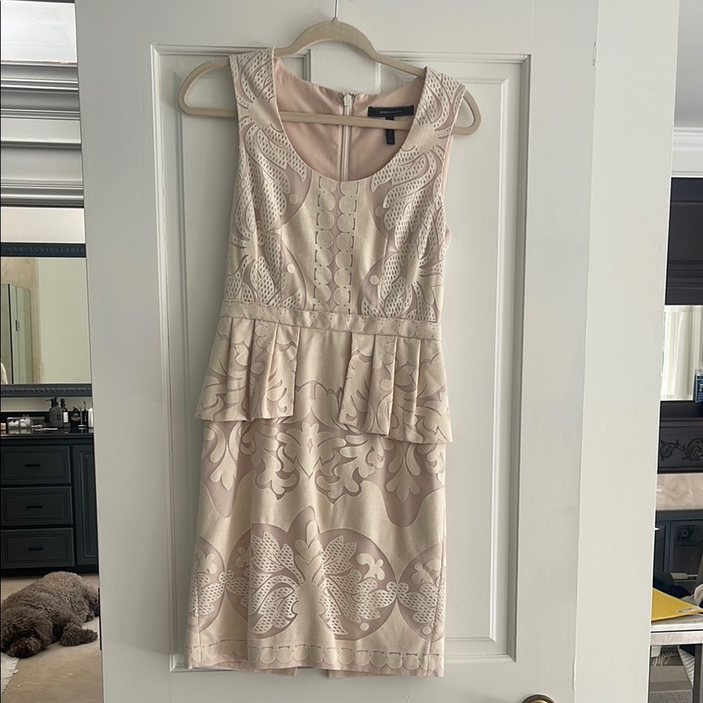 Elegant Cream Lace peplum
Mini Dress BCBG size 4
